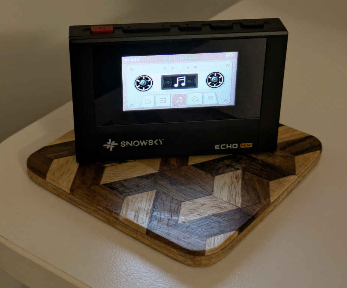 My Echo Mini player. It evokes a cassette player with its physical buttons, and its screen has a cassette inspired UI.